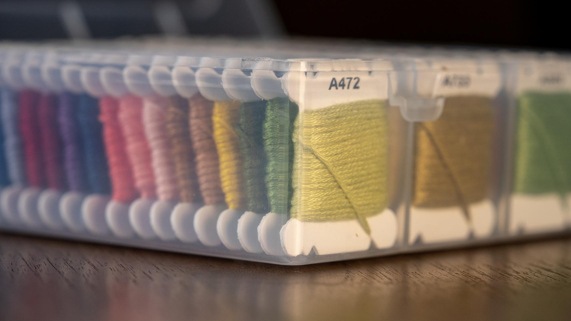 Assorted embroidered samples laid out on table